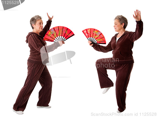 Image of Senior woman doing Tai Chi Yoga exercise