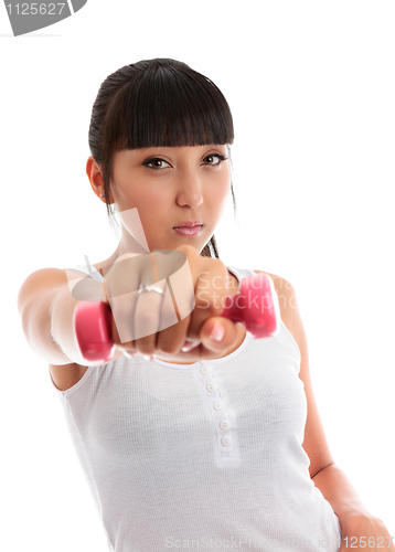 Image of Young woman using hand weights