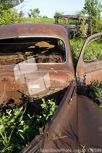 Image of Overgrown Antique Car