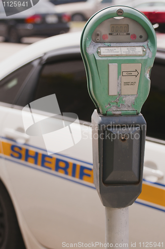 Image of Traffic meter and Sheriff car