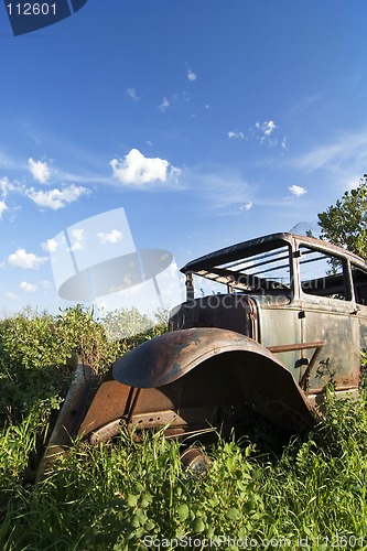 Image of Overgrown Antique Car