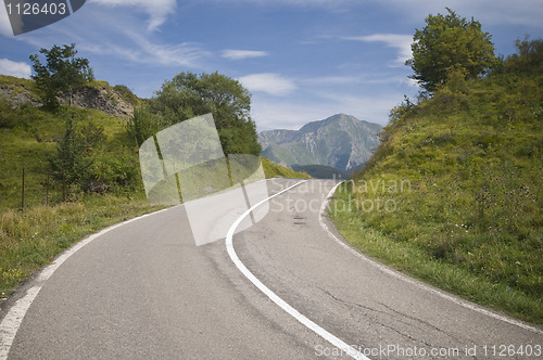 Image of Winding road leading into mountain valley