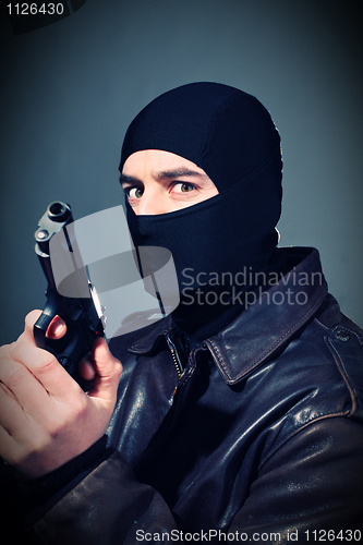 Image of criminal with gun