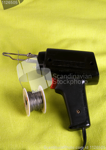 Image of soldering gun with solder roll