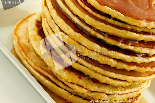 Image of Stack of pancakes with syrup