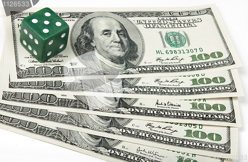 Image of Green dice and American money