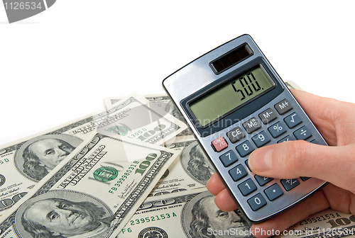 Image of Money and hand holing a calculator