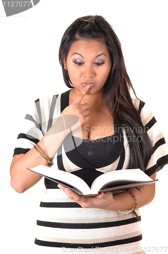 Image of Girl thinking about her book.