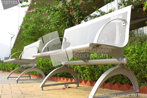 Image of two steel chair in the park