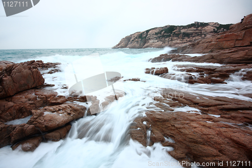 Image of Beautiful seascape. Sea and rock at the sunset. Nature compositi
