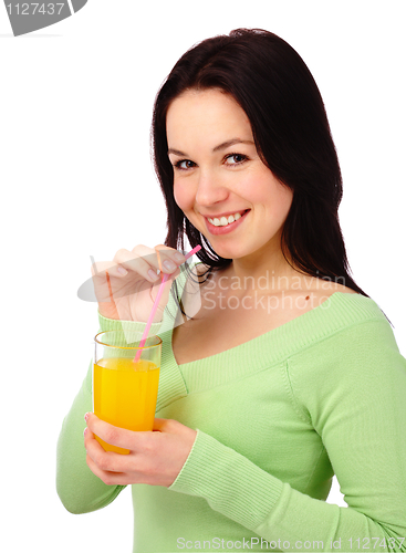 Image of Young attractive woman drinks orange juice