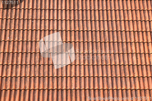 Image of Old red tile roof. A background