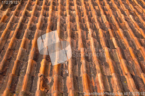 Image of Old red tile roof. A background