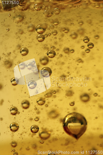 Image of Air vials in a golden liquid. A background 