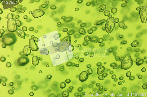 Image of Air vials in a green liquid. A background 