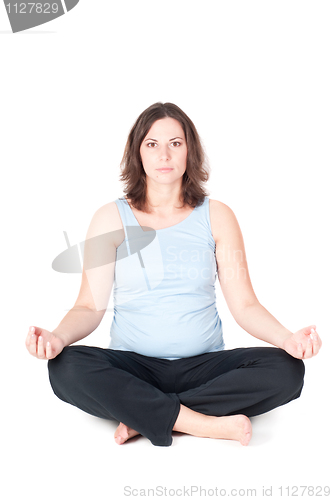 Image of Portrait of pretty pregnant woman practicing yoga