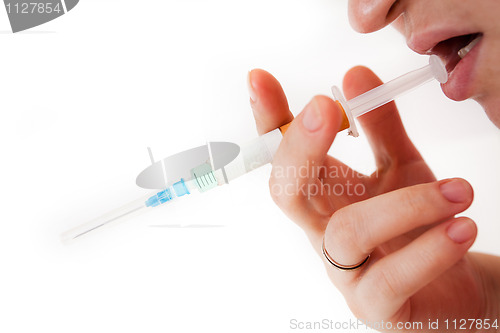 Image of Syringe in a palm of the addict