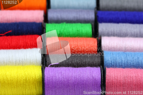 Image of lot of colored thread spools