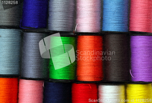 Image of lot of colored thread spools