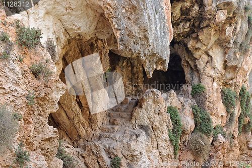 Image of Cave entrance with jagged stone teeth