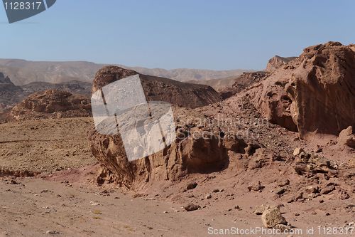 Image of Scenic weathered red rocks  in stone desert 