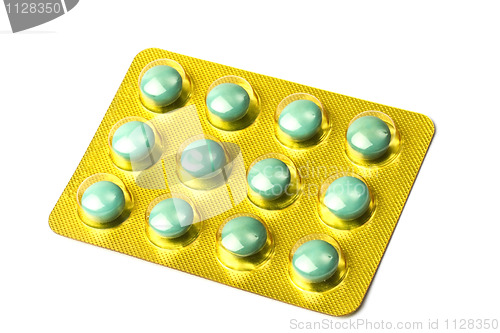 Image of Package of green pills isolated on white