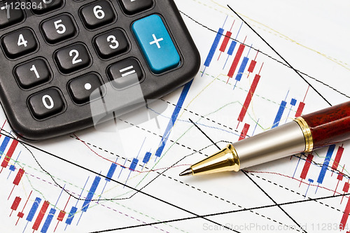 Image of  business graph and a magnifier 