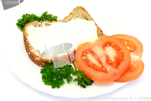 Image of breakfast with bread, tomatoes and parsley