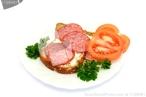 Image of breakfast with bread, tomatoes, parsley, salami