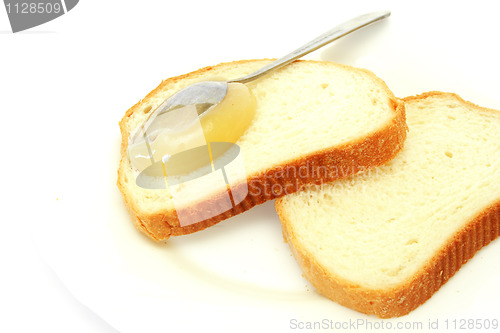 Image of white bread with a honey