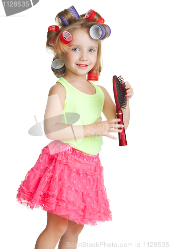 Image of Little girl play hairdresser