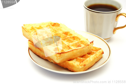 Image of white cup of coffee with waffle