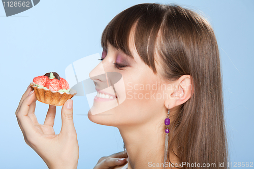 Image of Happy woman with tart cake