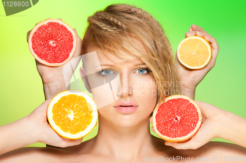 Image of Portrait of woman with fruits