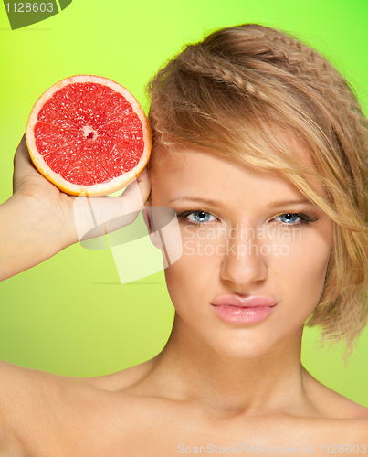 Image of Confident woman with fruit