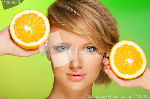 Image of Juicy oranges and beautiful woman