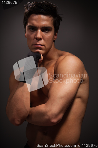 Image of Handsome muscular man thinking