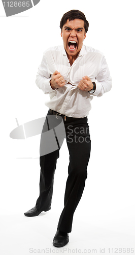 Image of Frustrated business man tearing apart his shirt
