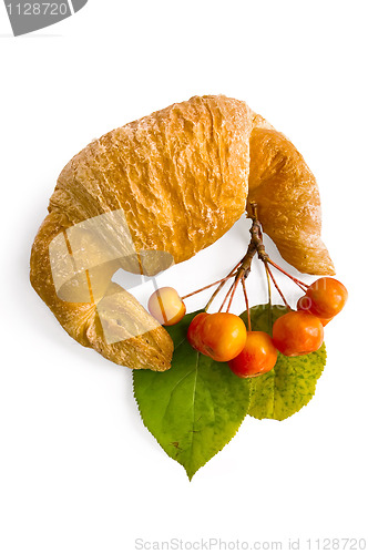 Image of Croissant with a sprig of apple