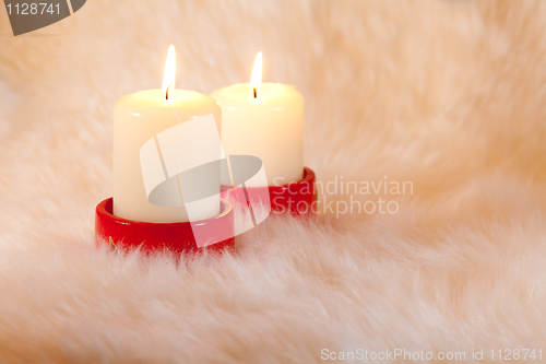 Image of candles on home like fur background
