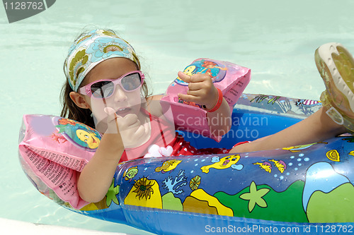 Image of Child in pool relaxing