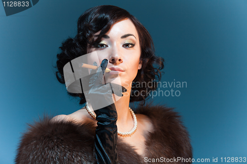 Image of Retro style woman with cigar