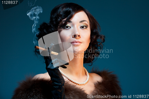 Image of Retro woman smoking cigar