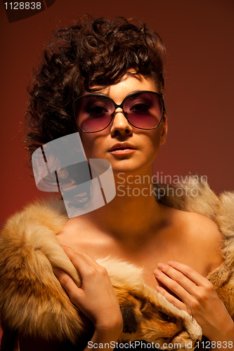 Image of Gorgeous woman in fur and glasses