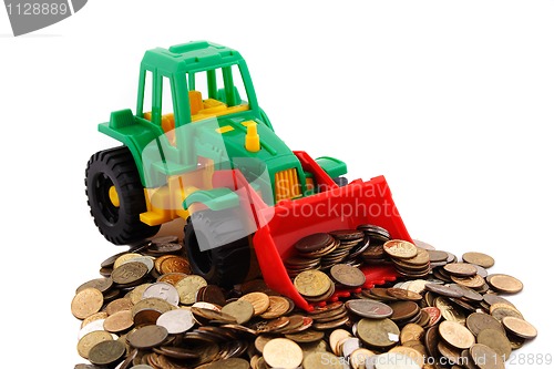 Image of Gree bulldozer raked pile of coins