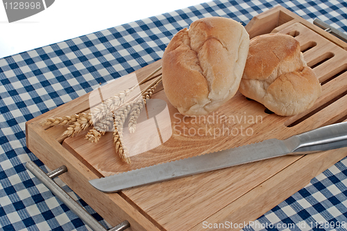 Image of Slices of bread on top of wooden board