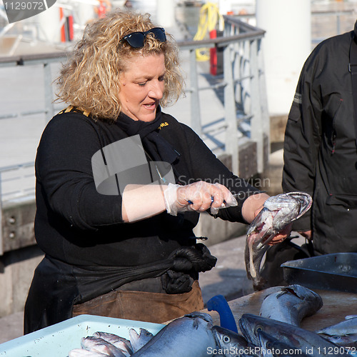 Image of MARSEILLE, FRANCE, MARCH 6: a fish saleswoman on the open-air market of the Vieux-port, on Sunday, March 6th, 2011, in Marseille, France.