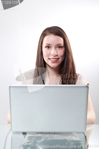 Image of Businesswoman working on a laptop