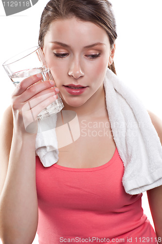 Image of Sporty woman holding water