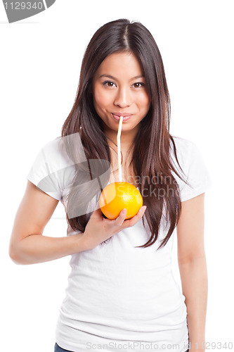 Image of Asian woman drinking orange juice